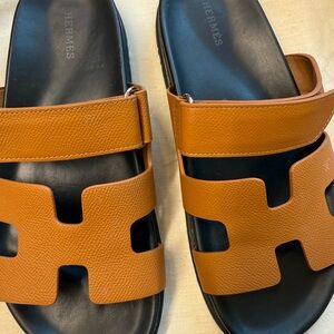Hermes Orange and Black Sandals Elegant Leather Design